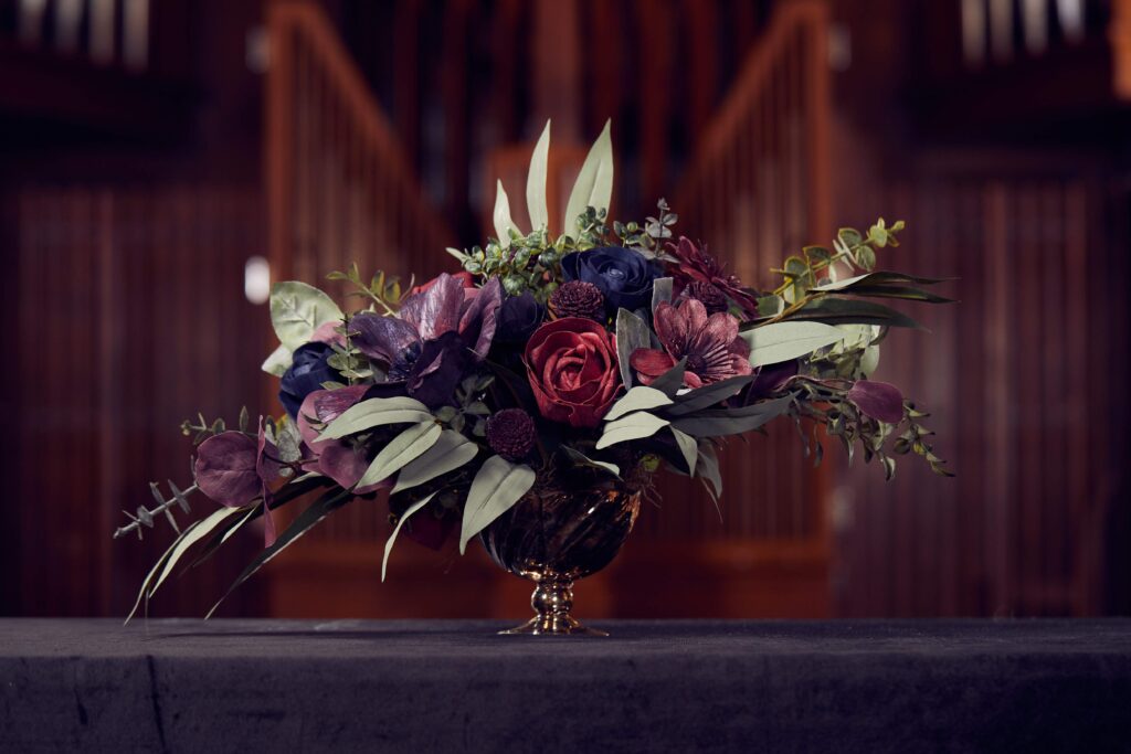 jewel toned wood flower centerpiece in gold compote bowl